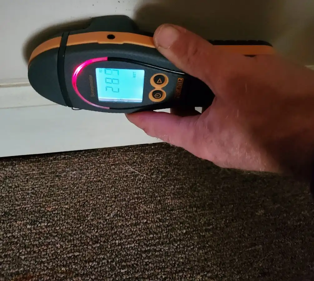 Moisture detection at baseboard during Storm Damage Restoration in Mount Laurel